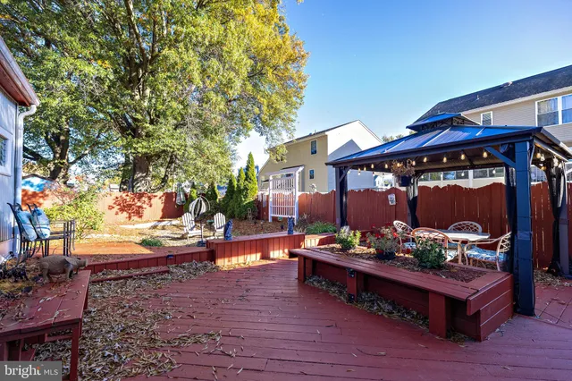 a view of a chairs and tables in the patio and a chandelier