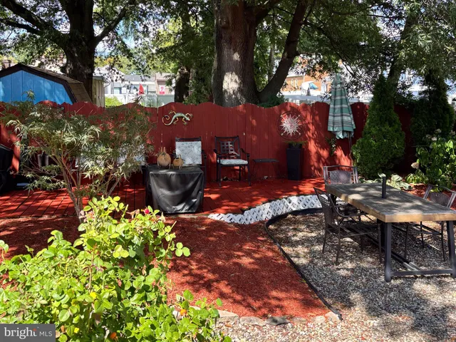 a front view of a house with sitting area