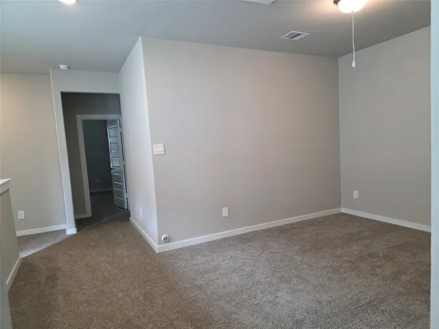 an empty room with closet area