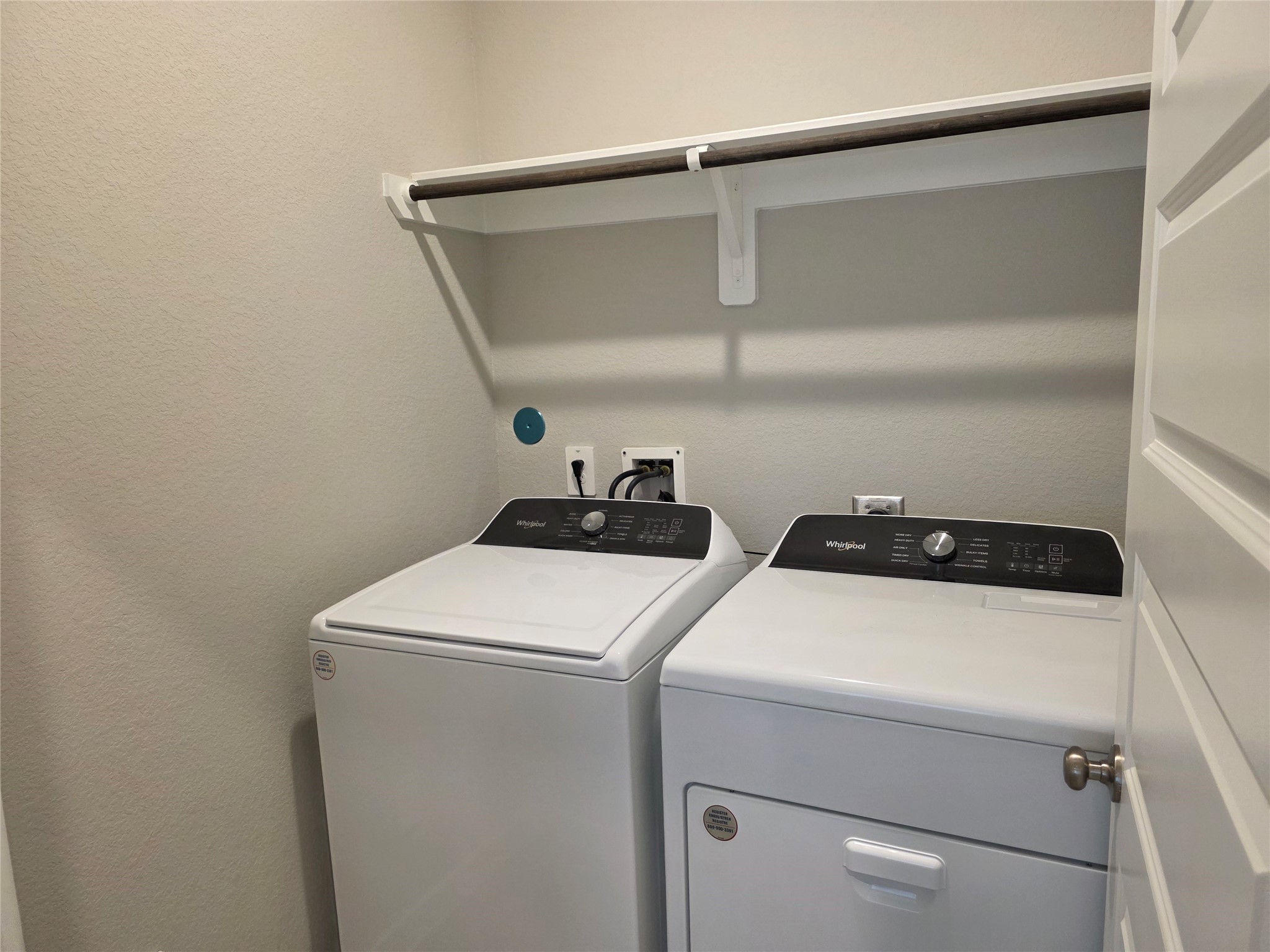4114 Glowing Hearth Drive Houston, TX 77080 - Photo 8 of 14 a utility room with dryer and washer