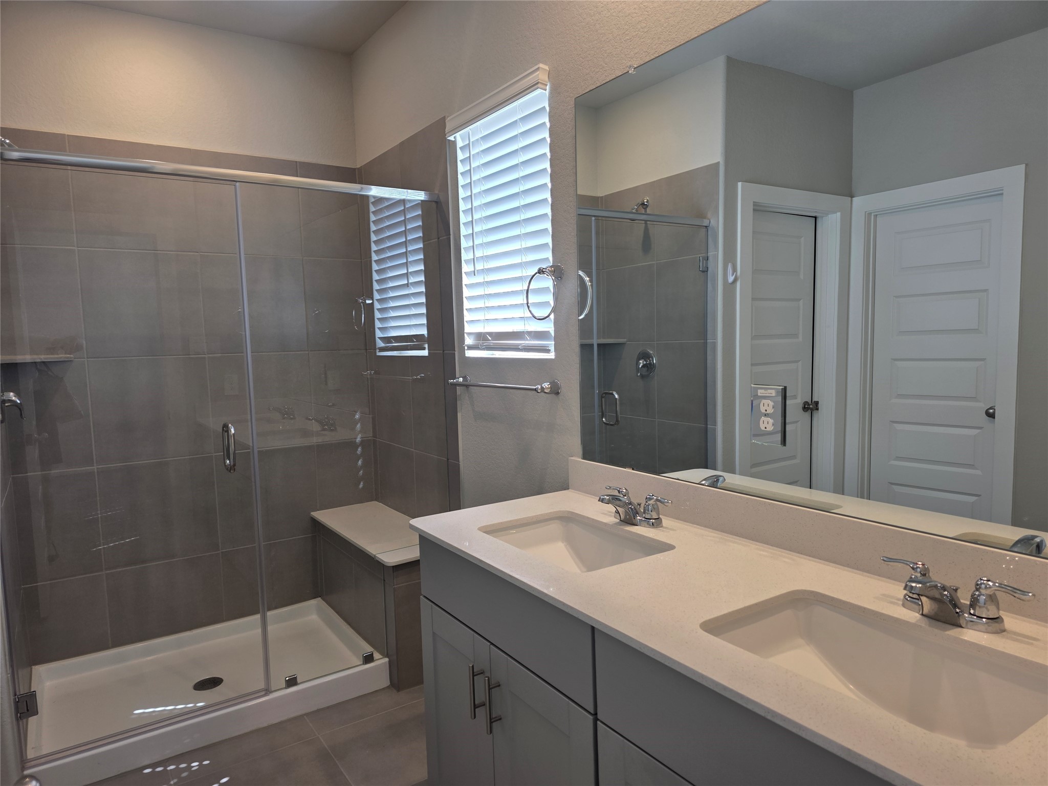 4114 Glowing Hearth Drive Houston, TX 77080 - Photo 10 of 14 a bathroom with a shower sink and mirror