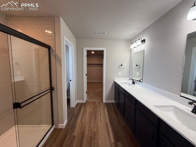 459 Atchison Way Calhan, CO 80808 - Photo 3 of 11 a spacious bathroom with a double vanity sink a mirror and shower