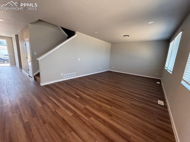 459 Atchison Way Calhan, CO 80808 - Photo 8 of 11 a view of an empty room with wooden floor