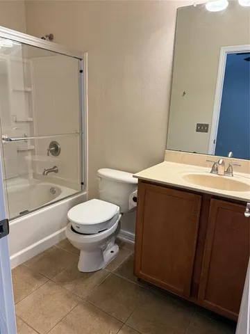 an empty room with wooden floor and closet