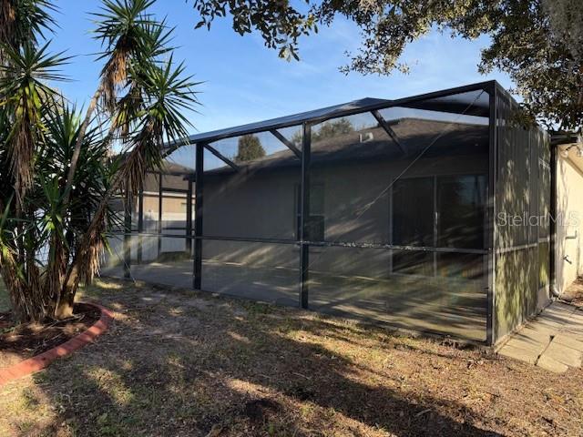 12311 Boot Spur Way Spring Hill, FL 34610 - Photo 24 of 25 a view of a house with a yard