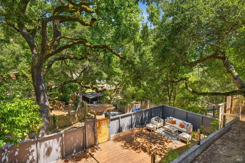 a view of a house with large tree