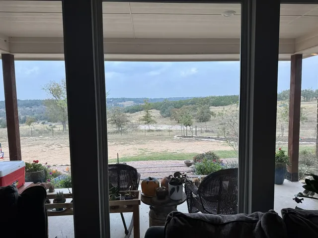 a view of a room with balcony and ocean view