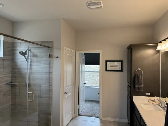 a bathroom with a sink and mirror