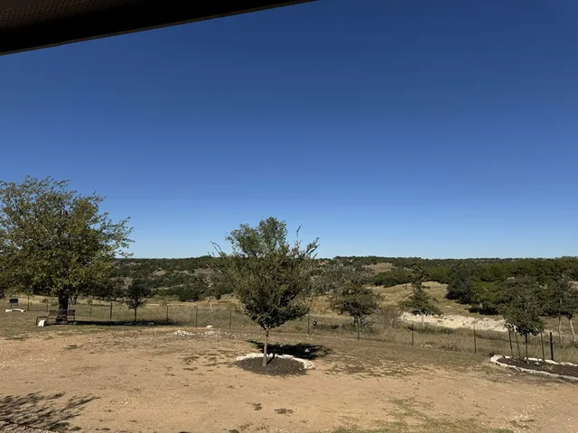 a view of a road with a building in the background