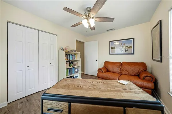 a bedroom with a bed and dresser