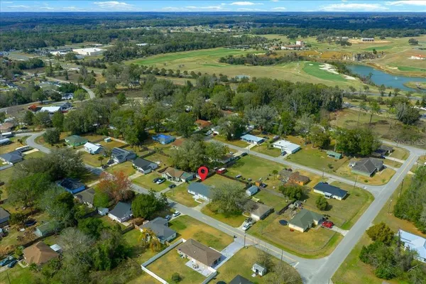 an aerial view of residential houses with outdoor space