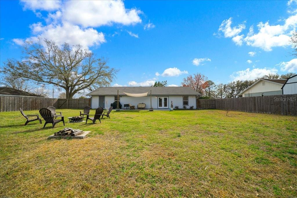 685 Northwest 67th Place Ocala, FL 34475 - Photo 3 of 33 a swimming pool with outdoor seating and yard