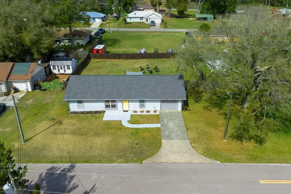 an aerial view of a house with swimming pool