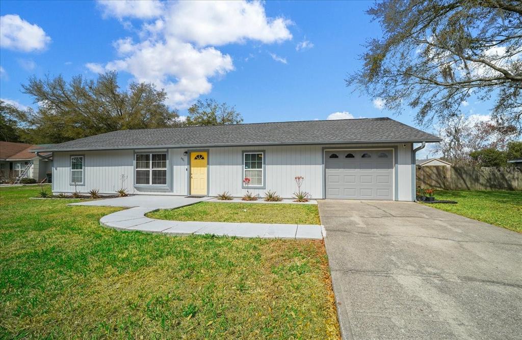 685 Northwest 67th Place Ocala, FL 34475 - Photo 32 of 33 a front view of house with yard and green space