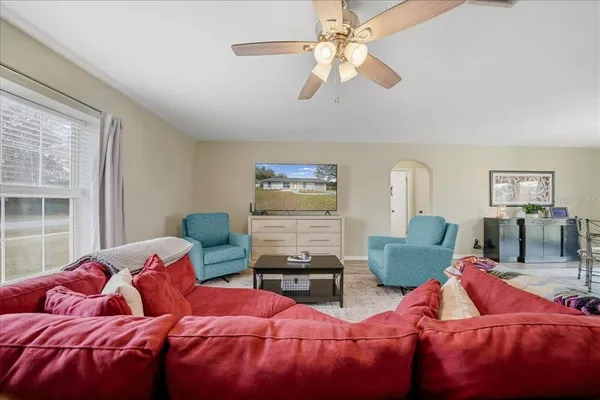 a bedroom with two beds and a chandelier
