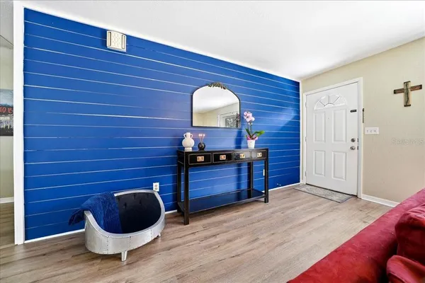 a room with a chair and a wooden floor