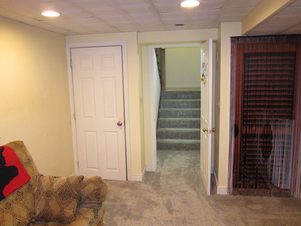136 Mountain Gate Road, Unit 136 Ashland, MA 01721 - Photo 23 of 23 a view of a livingroom with an empty space and stairs