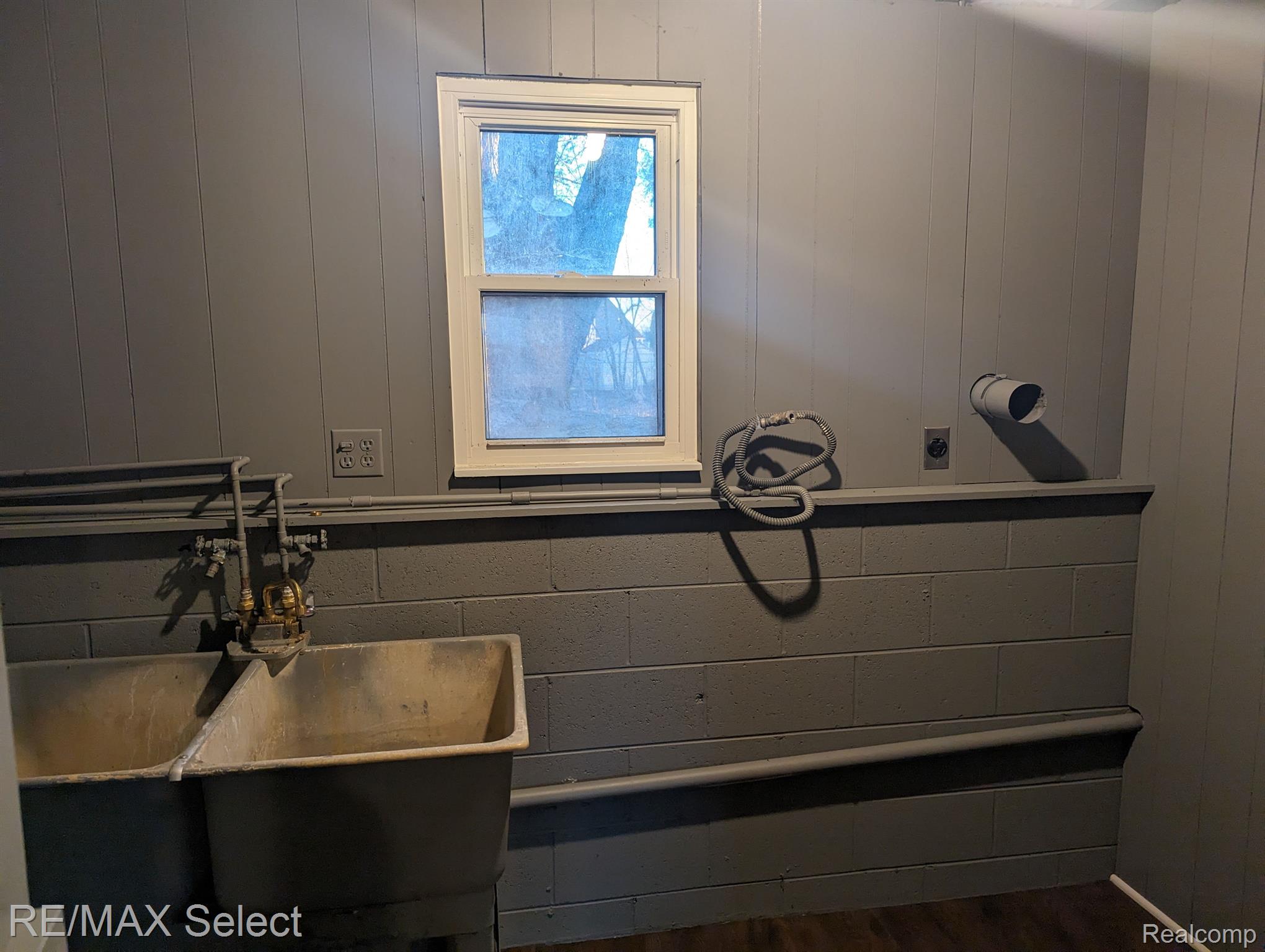 8199 Carpenter Road Flushing, MI 48433 - Photo 22 of 34 Laundry Room is right at the bottom of the stairs