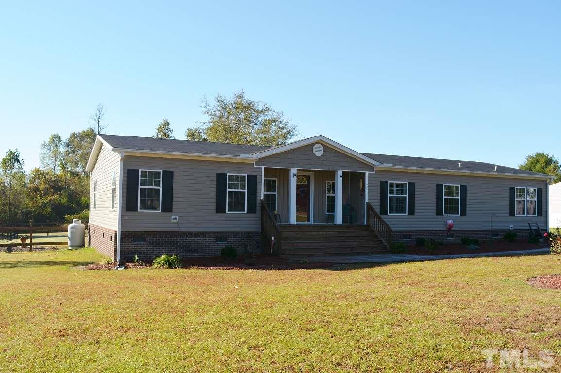 747 Glover Road Dunn, NC 28334 - Photo 2 of 25 a front view of a house with a yard