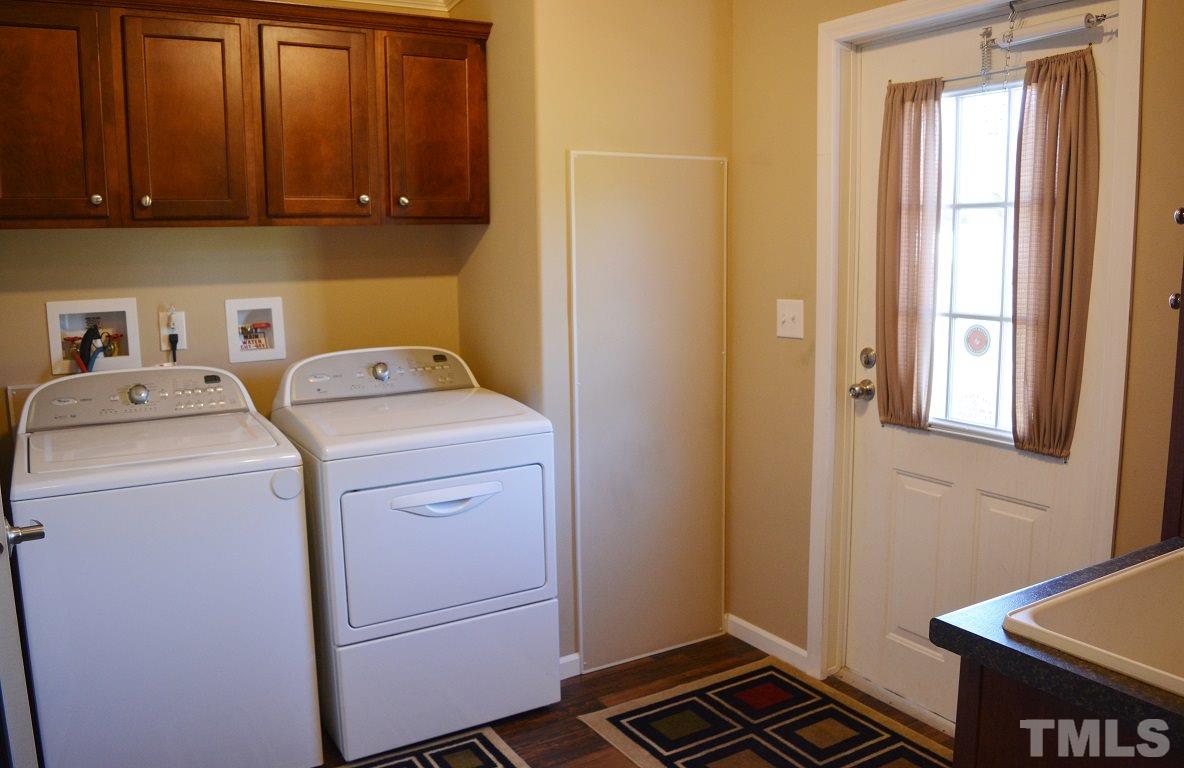 747 Glover Road Dunn, NC 28334 - Photo 19 of 25 a utility room with dryer and washer