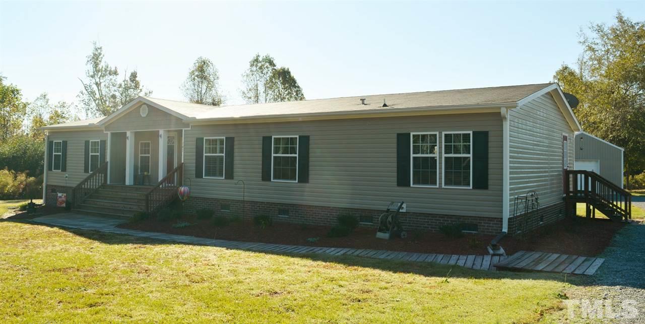 747 Glover Road Dunn, NC 28334 - Photo 3 of 25 a view of a house with a yard