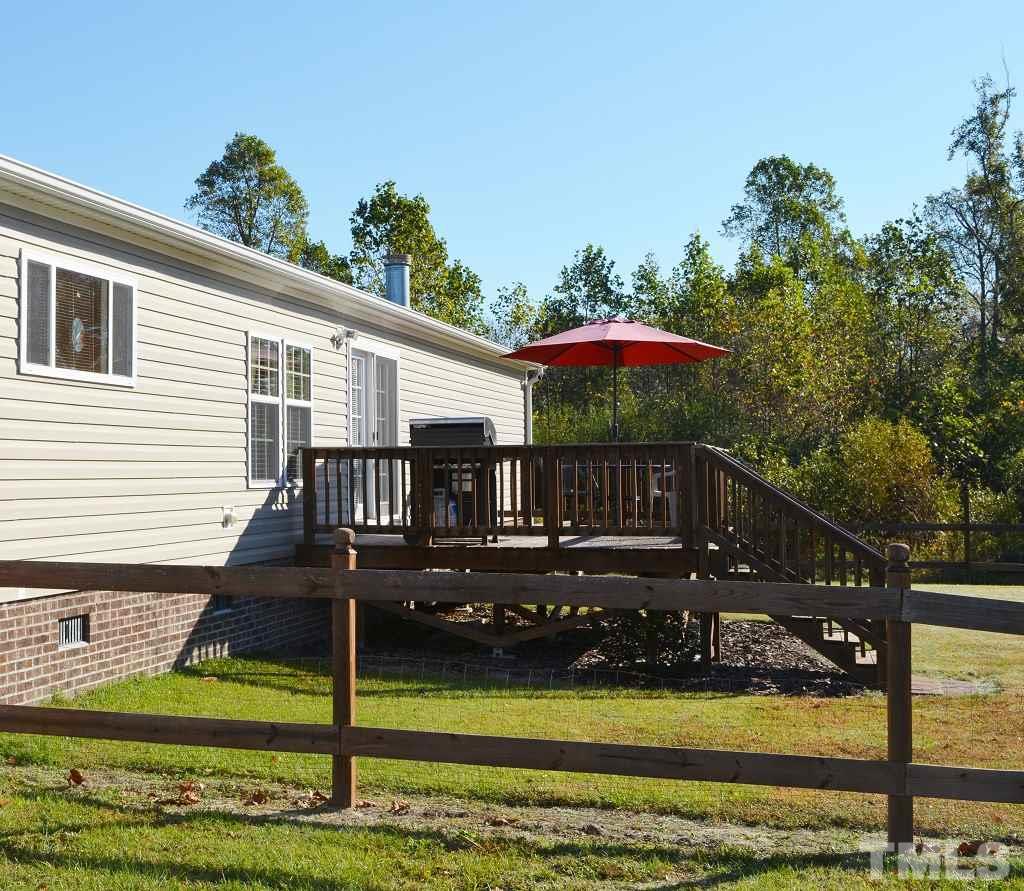 747 Glover Road Dunn, NC 28334 - Photo 21 of 25 a front view of house with yard and swimming pool