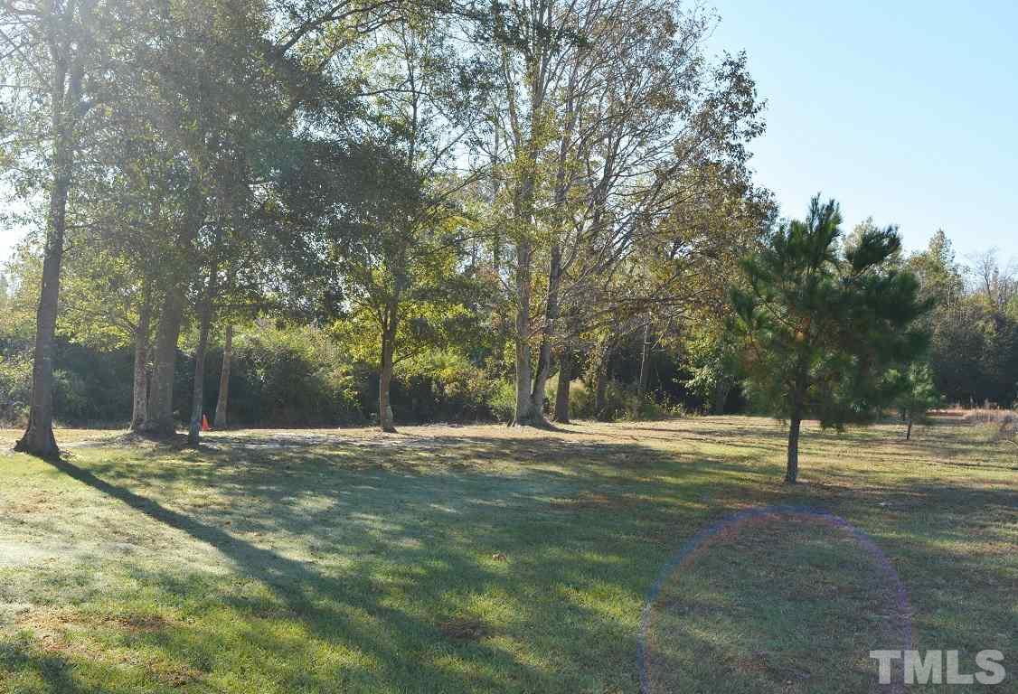 747 Glover Road Dunn, NC 28334 - Photo 25 of 25 a view of empty space with trees