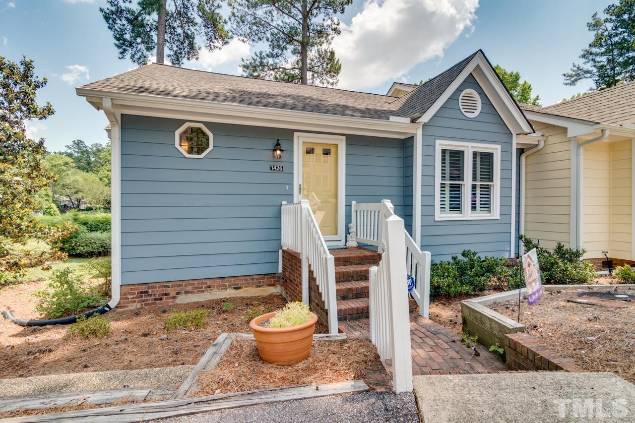 1426 Mapleside Court Raleigh, NC 27609 - Photo 1 of 38 a front view of a house with garden