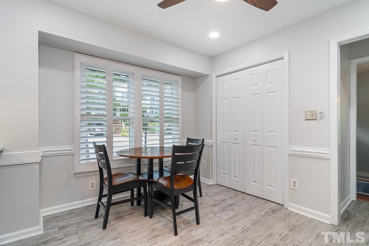 1426 Mapleside Court Raleigh, NC 27609 - Photo 13 of 38 a view of a dining room with furniture window and wooden floor