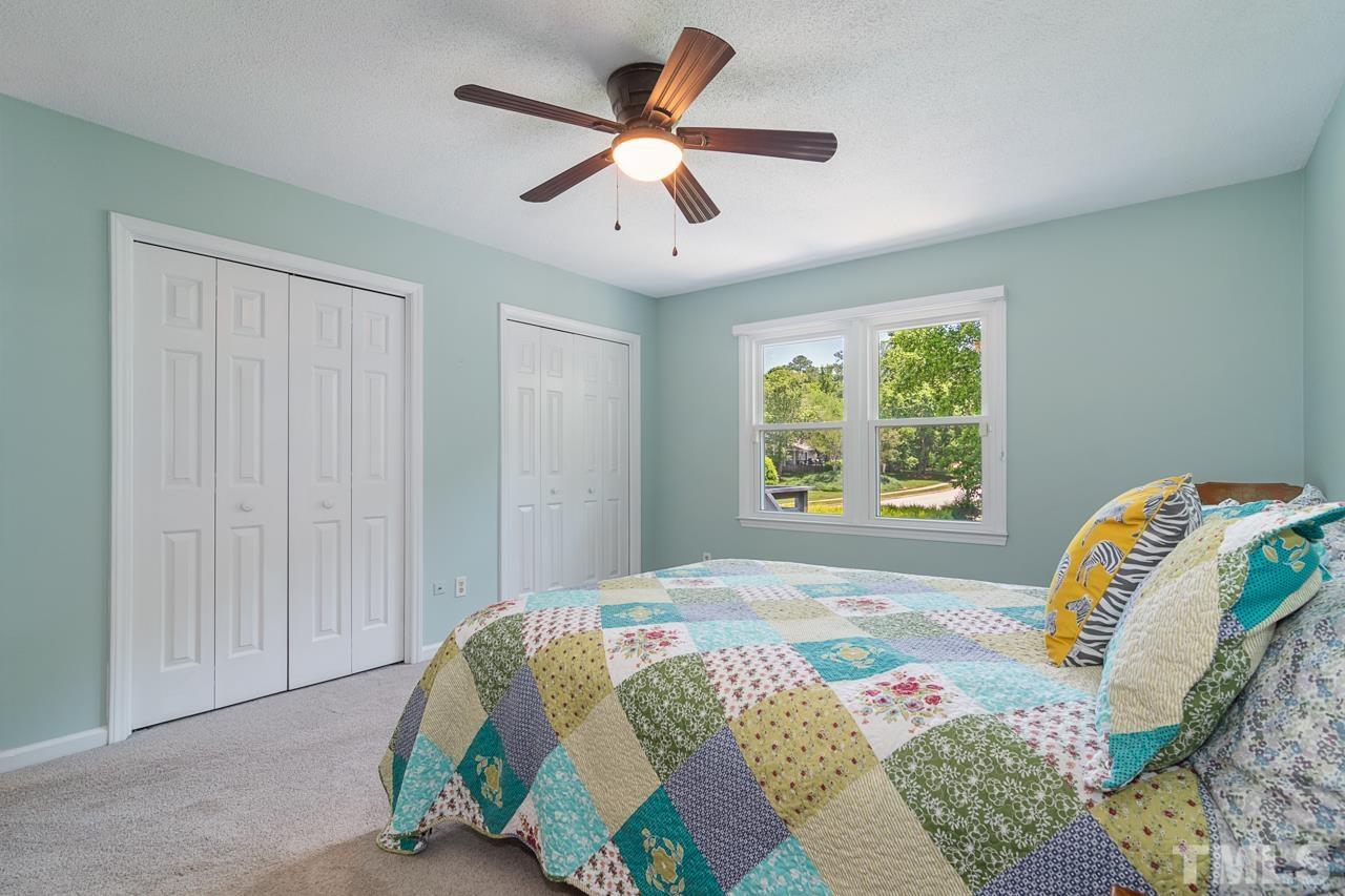 1426 Mapleside Court Raleigh, NC 27609 - Photo 16 of 38 a bedroom with a bed and a window