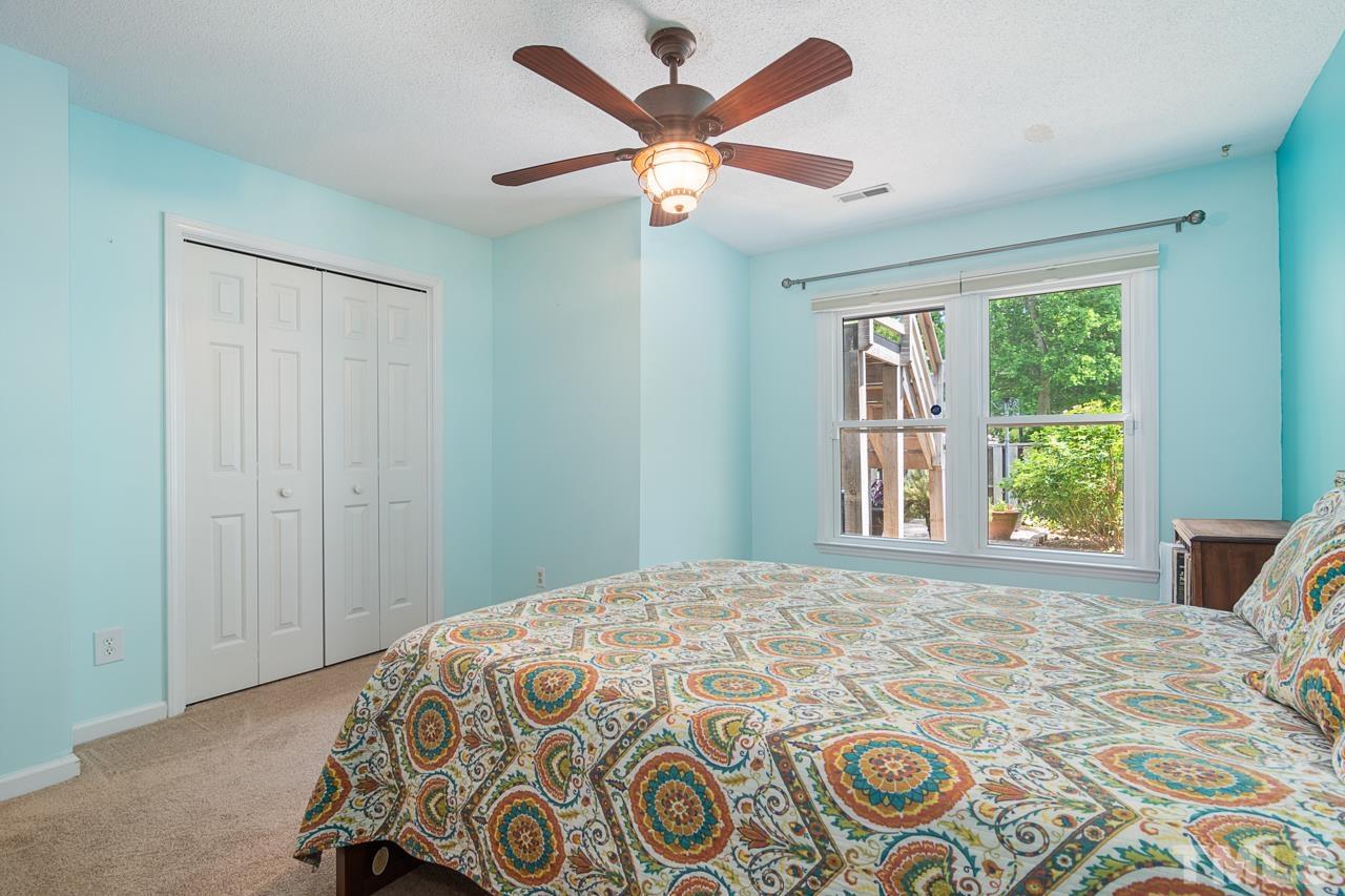 1426 Mapleside Court Raleigh, NC 27609 - Photo 19 of 38 a bedroom with a bed and a window
