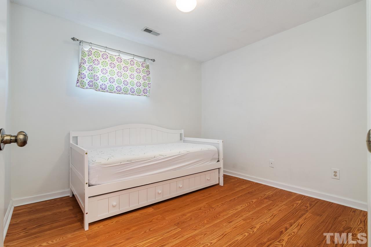 1426 Mapleside Court Raleigh, NC 27609 - Photo 20 of 38 a view of room with hardwood floor and window