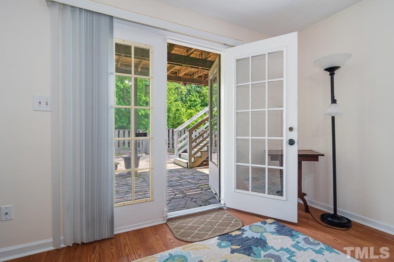 1426 Mapleside Court Raleigh, NC 27609 - Photo 23 of 38 a view of an empty room with wooden floor and a window