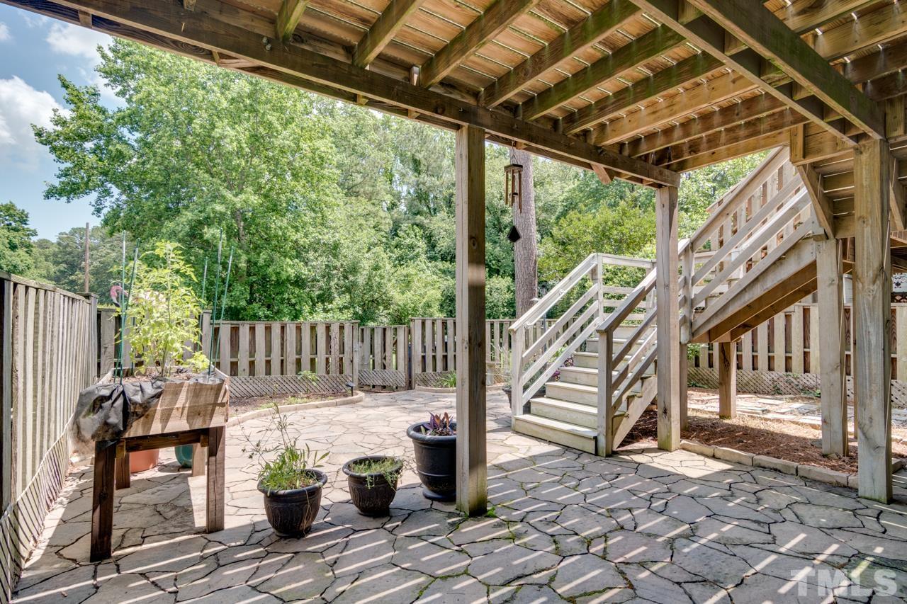 1426 Mapleside Court Raleigh, NC 27609 - Photo 26 of 38 a view of a deck with wooden floor and outdoor seating