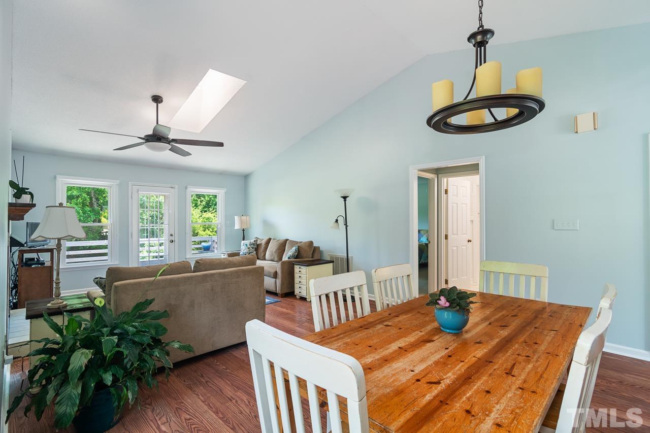 1426 Mapleside Court Raleigh, NC 27609 - Photo 3 of 38 a living room with furniture and a large window
