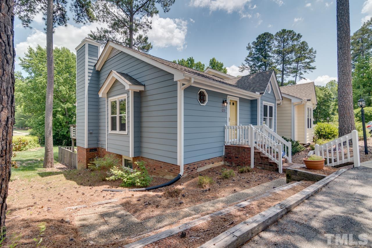 1426 Mapleside Court Raleigh, NC 27609 - Photo 31 of 38 a front view of a house with garden