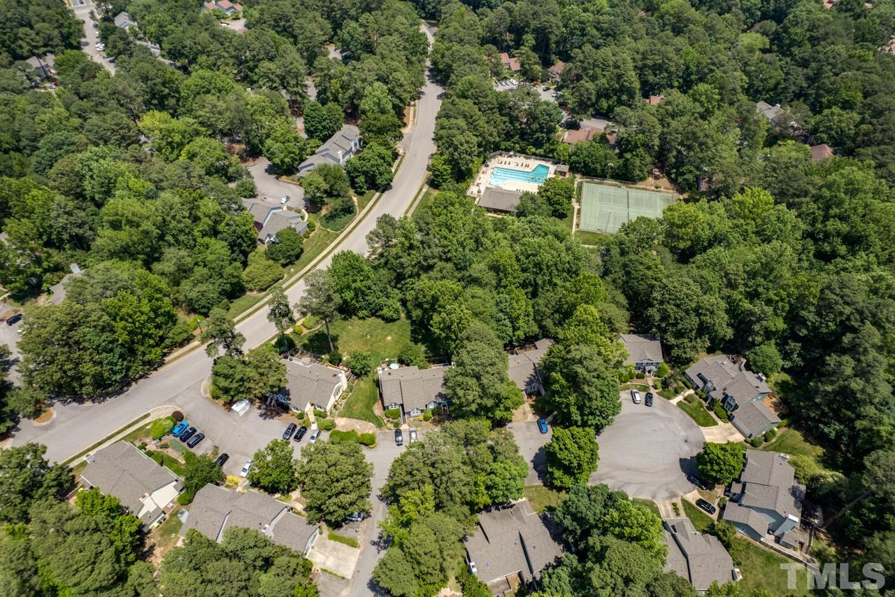 1426 Mapleside Court Raleigh, NC 27609 - Photo 37 of 38 an aerial view of a house with a yard and lake view