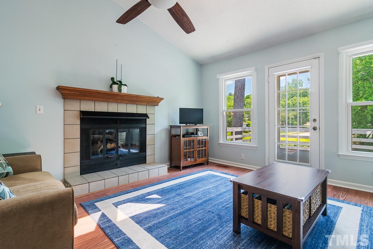 1426 Mapleside Court Raleigh, NC 27609 - Photo 6 of 38 a living room with furniture and a fireplace