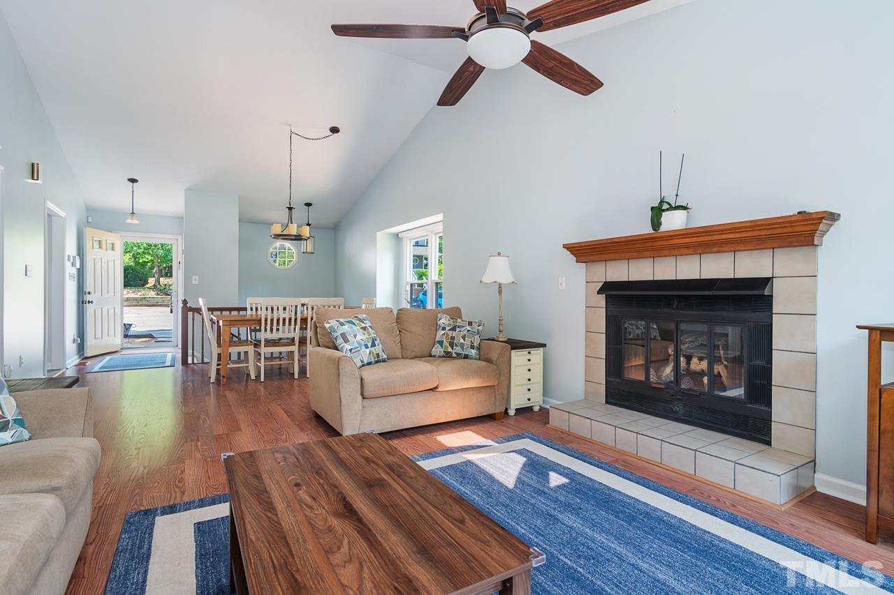 1426 Mapleside Court Raleigh, NC 27609 - Photo 7 of 38 a living room with furniture and a fireplace
