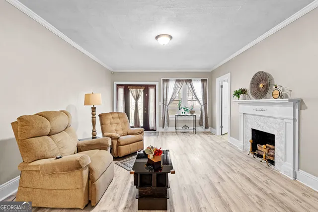 a view of a dining room with furniture and chandelier