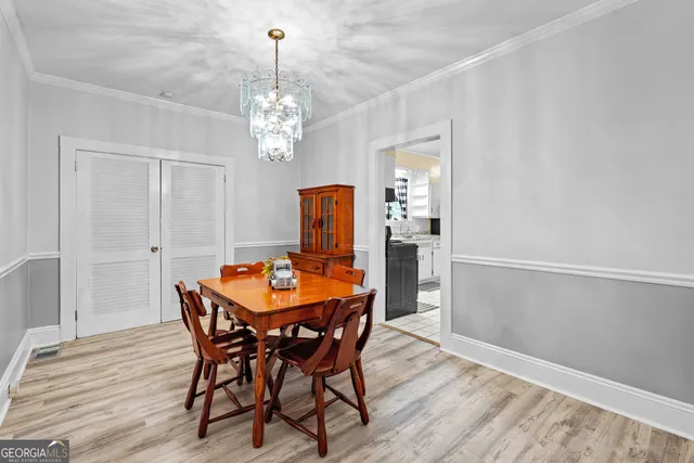 a kitchen with a stove a sink and a refrigerator