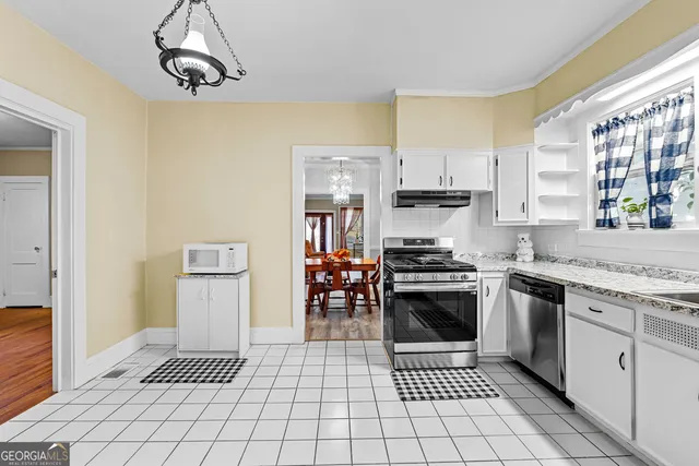 a kitchen with a sink a stove and refrigerator