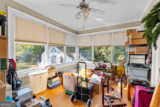 a room with musical instrument pool table and windows