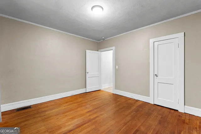 a room with furniture and a wooden floor