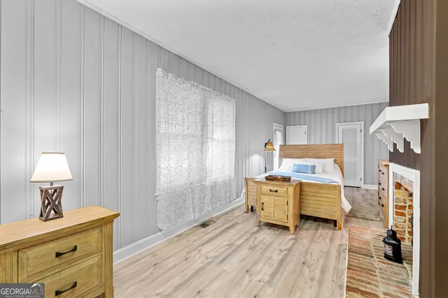 a bed room with a bed and a window