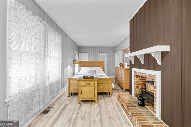 a view of living room with furniture and a fireplace