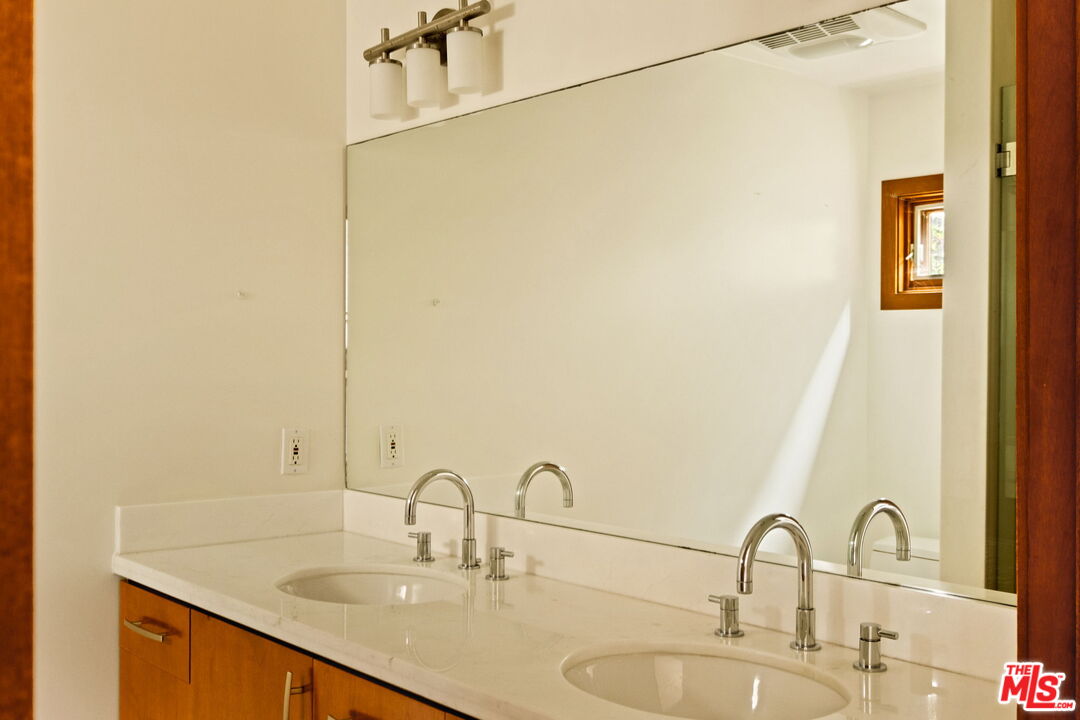 2325 Abbot Kinney Boulevard Venice, CA 90291 - Photo 11 of 32 a bathroom with a double vanity sink and a mirror