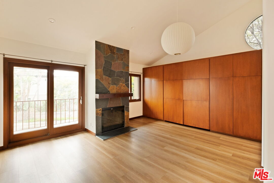 2325 Abbot Kinney Boulevard Venice, CA 90291 - Photo 14 of 32 a view of an empty room with a window and wooden floor