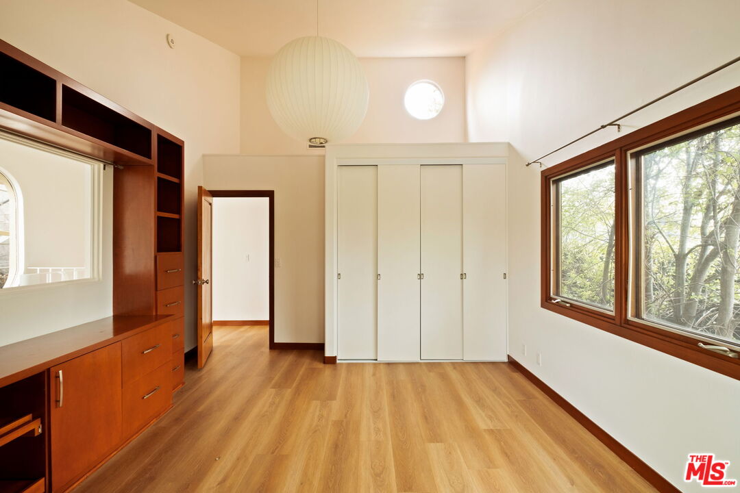 2325 Abbot Kinney Boulevard Venice, CA 90291 - Photo 18 of 32 wooden floor in an empty room with a window
