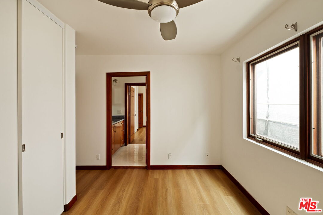 2325 Abbot Kinney Boulevard Venice, CA 90291 - Photo 22 of 32 a view of an empty room with window and wooden floor